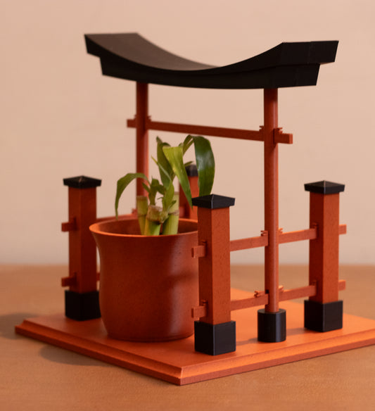 Torii gateway planter in clay with money plant