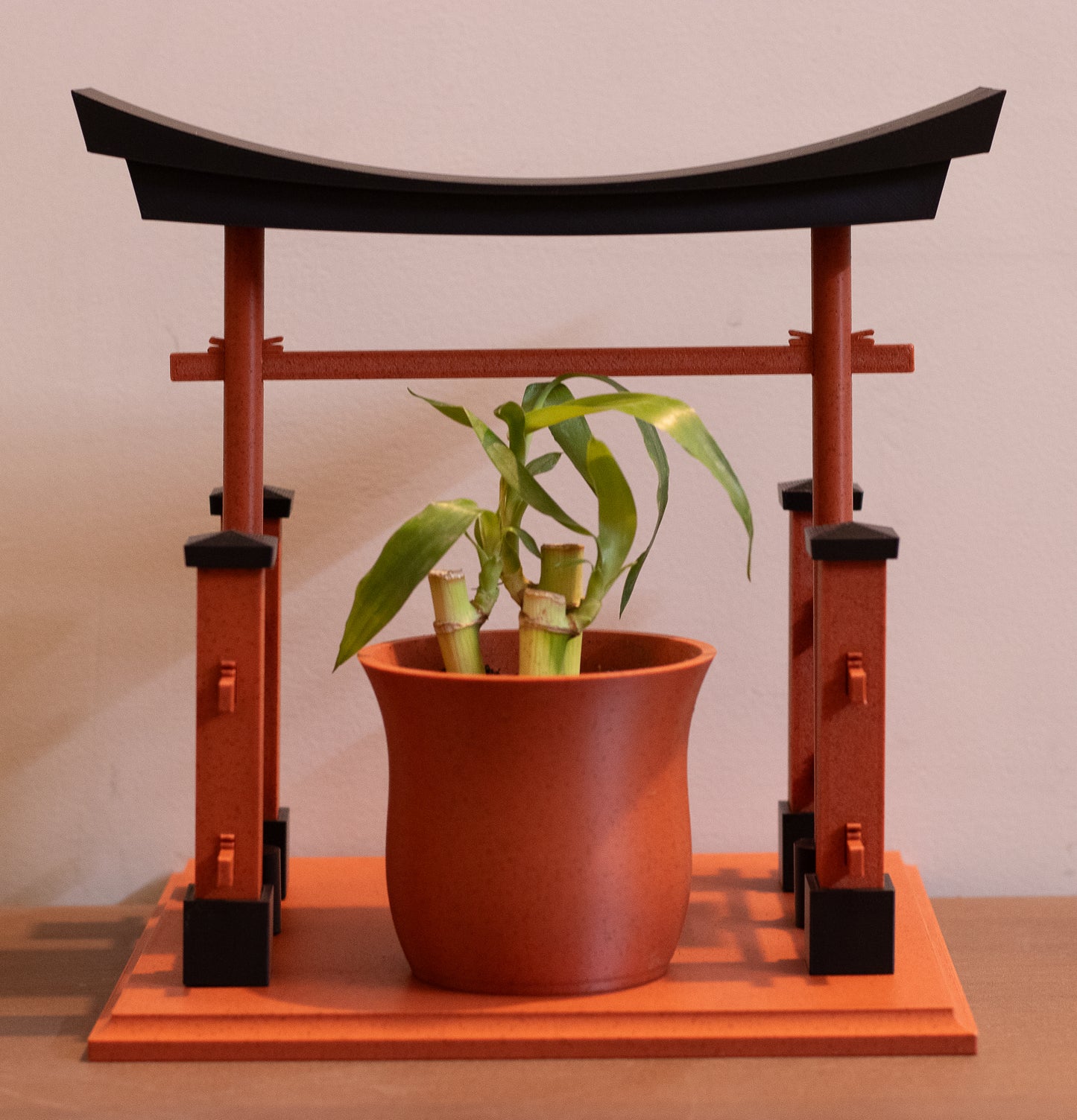 Torii gateway planter in clay with money plant